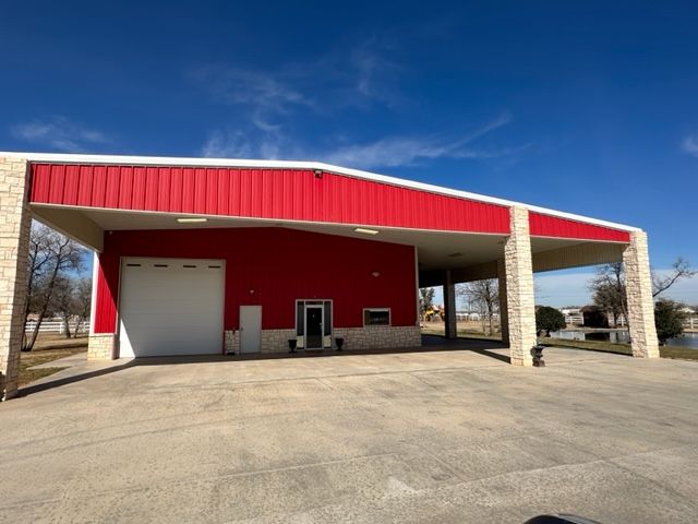 A large red building with a white garage door