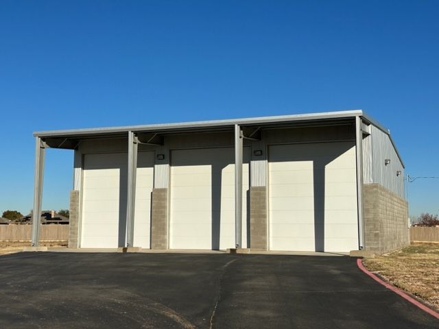 A white building with a blue sky in the background