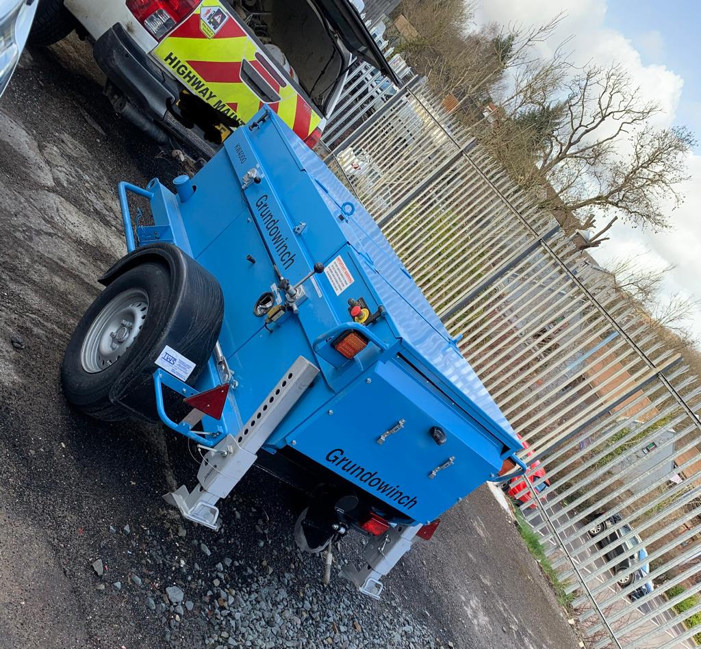 DP Cable Jointing | A blue trailer with the word guinness on it