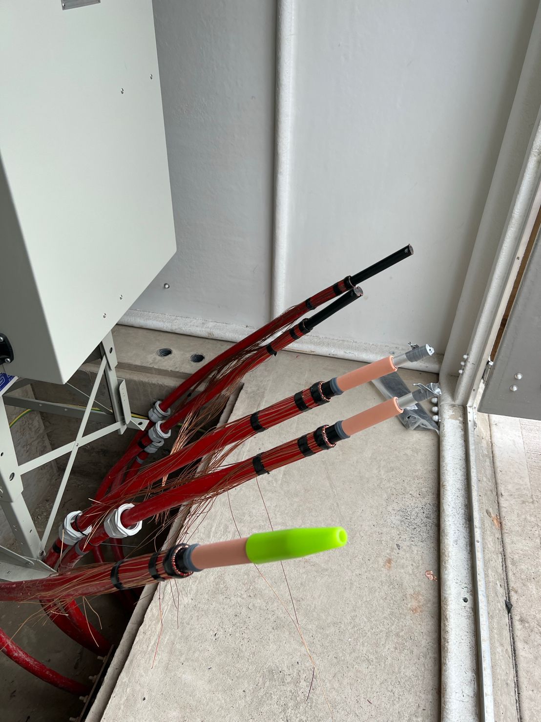 DP Cable Jointing | A bunch of fishing rods are sitting on the floor in a room.