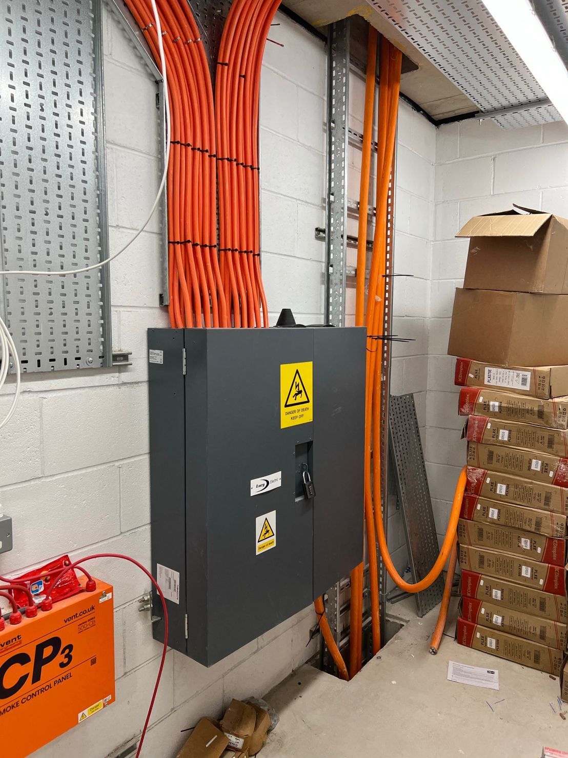 DP Cable Jointing | A room with a bunch of orange wires hanging from the ceiling