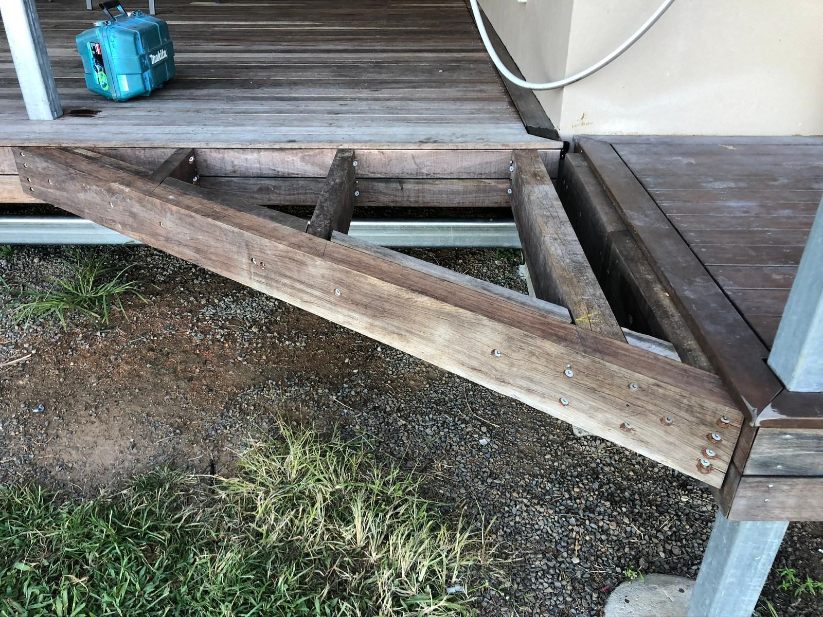Wooden Deck With Angled Support Beams Over Gravel and Grass — Ericson Constructions in Mareeba, QLD