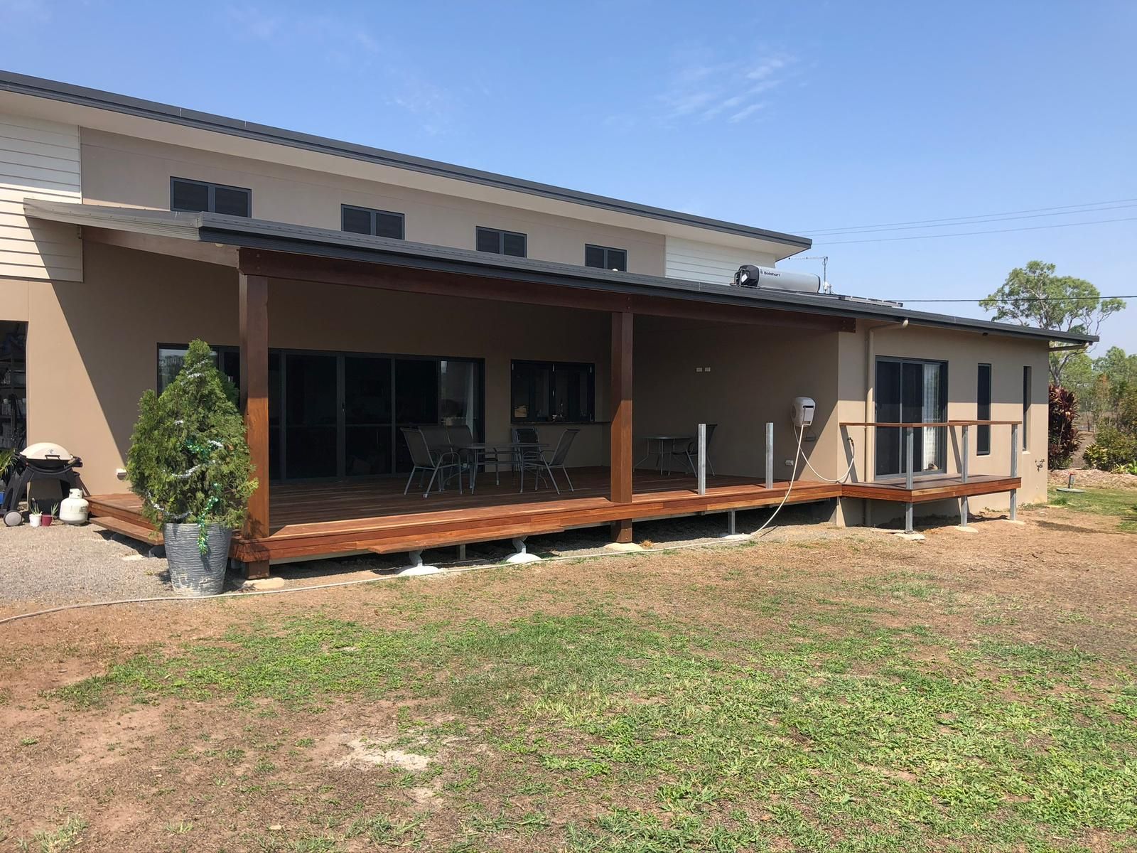 Balcony With Seating, Overlooking Trees And A Body Of Water — Ericson Constructions in Mareeba, QLD
