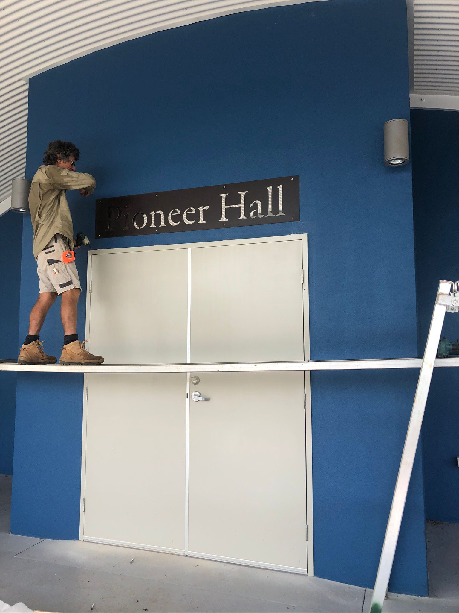 Person installing sign 