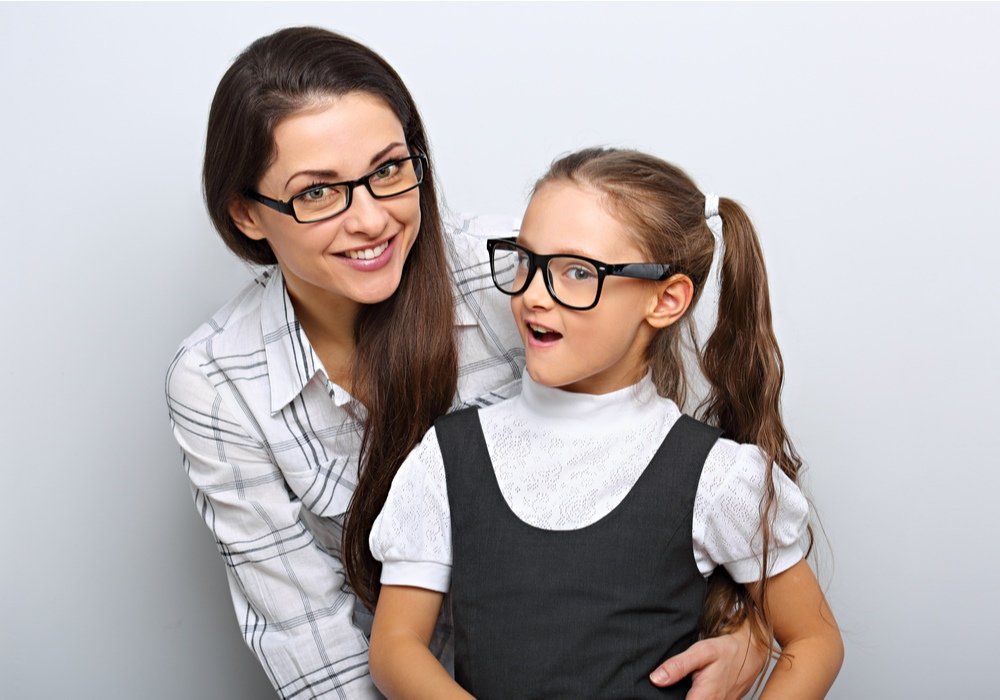 woman and a daughter wearing spectacles
