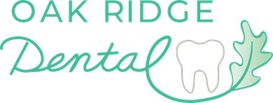 The logo for oak ridge dental shows a tooth and an oak leaf.