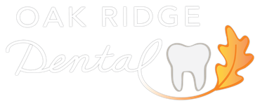 The logo for oak ridge dental has a tooth and an oak leaf.
