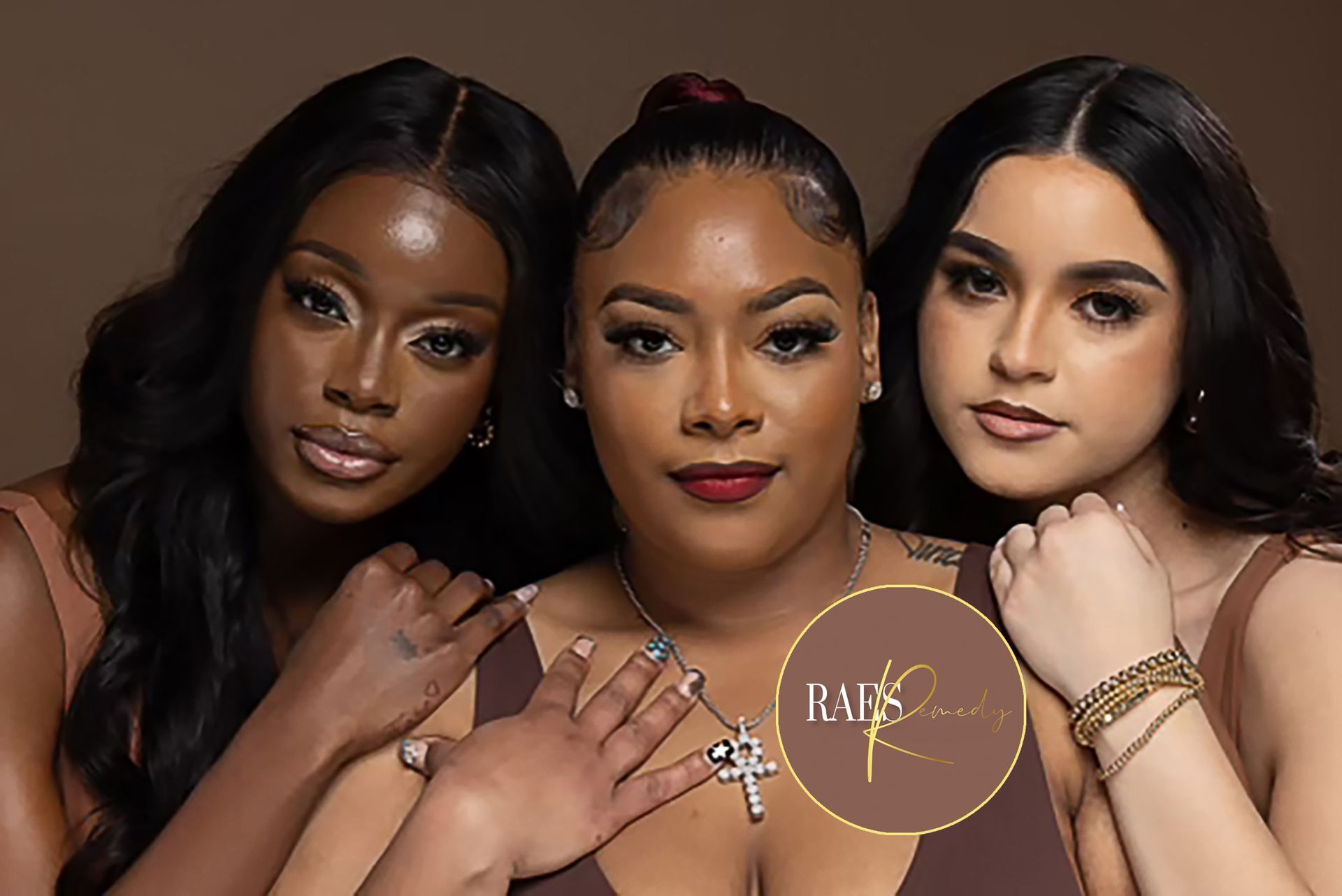 A woman in a blue suit with a cross necklace