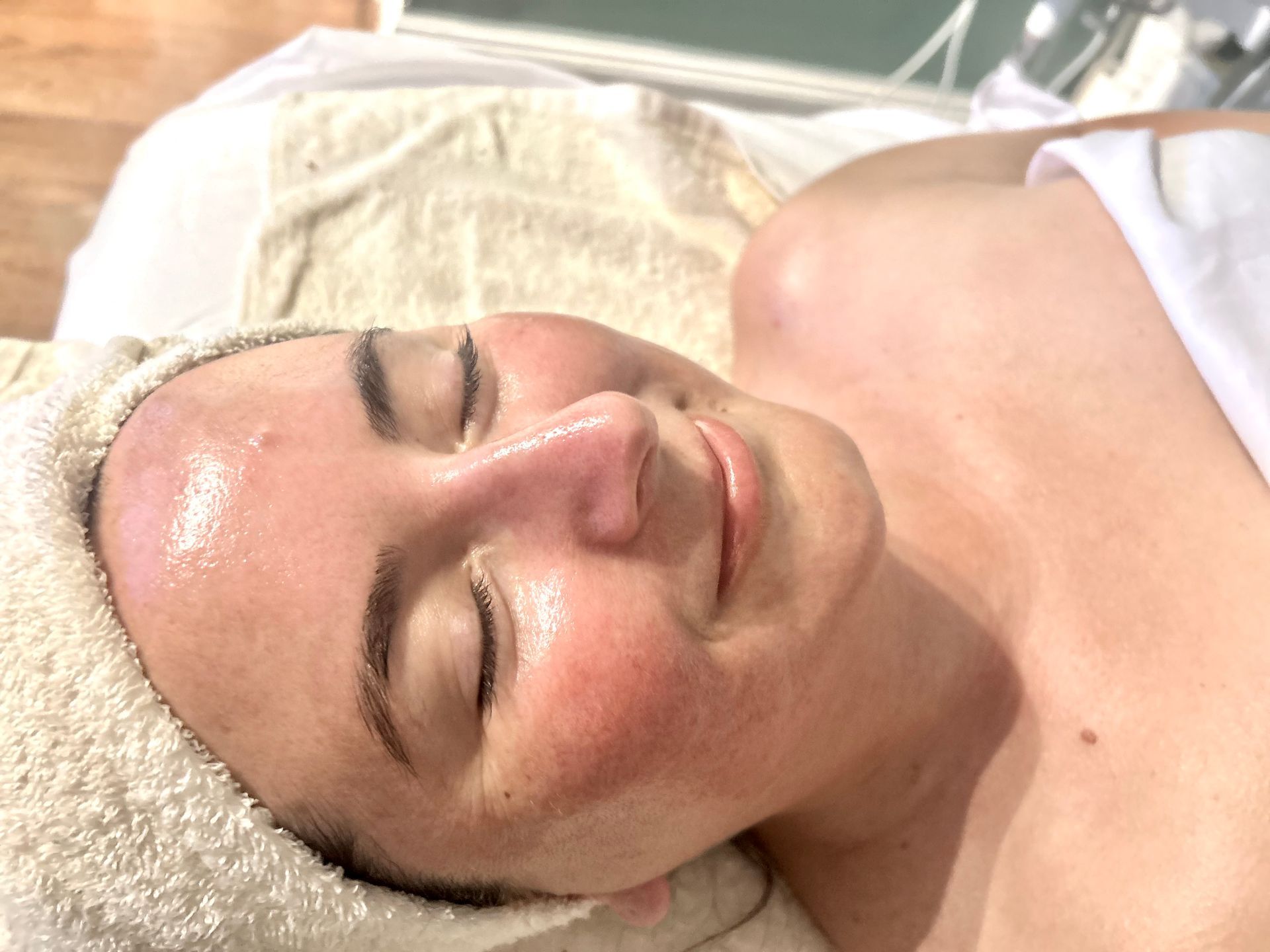 A woman is getting a clarifying facial treatment at Spa La La Tampa..