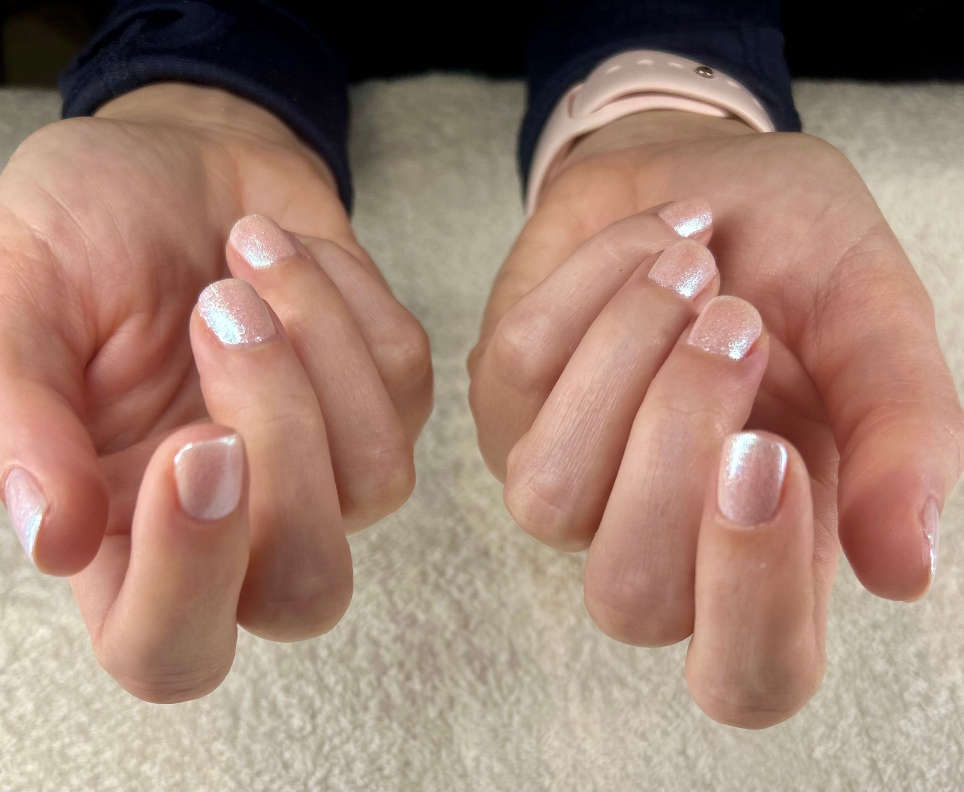 Close up of Dazzle dry manicure at Spa La La Tampa with light pink frosted nails