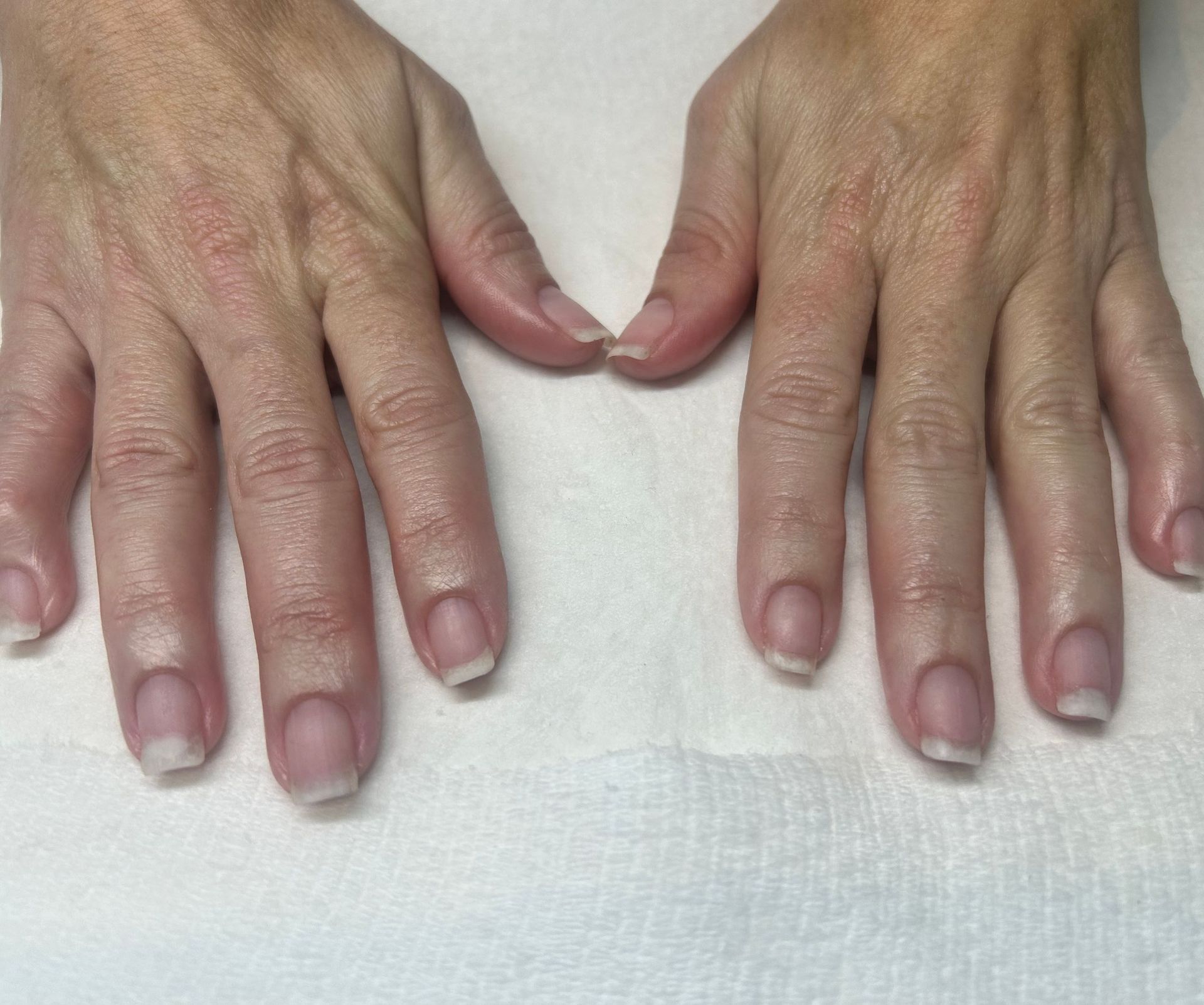 Close up dark painted nails at  Spa La La Tampa after a Dazzle Dry manicure.