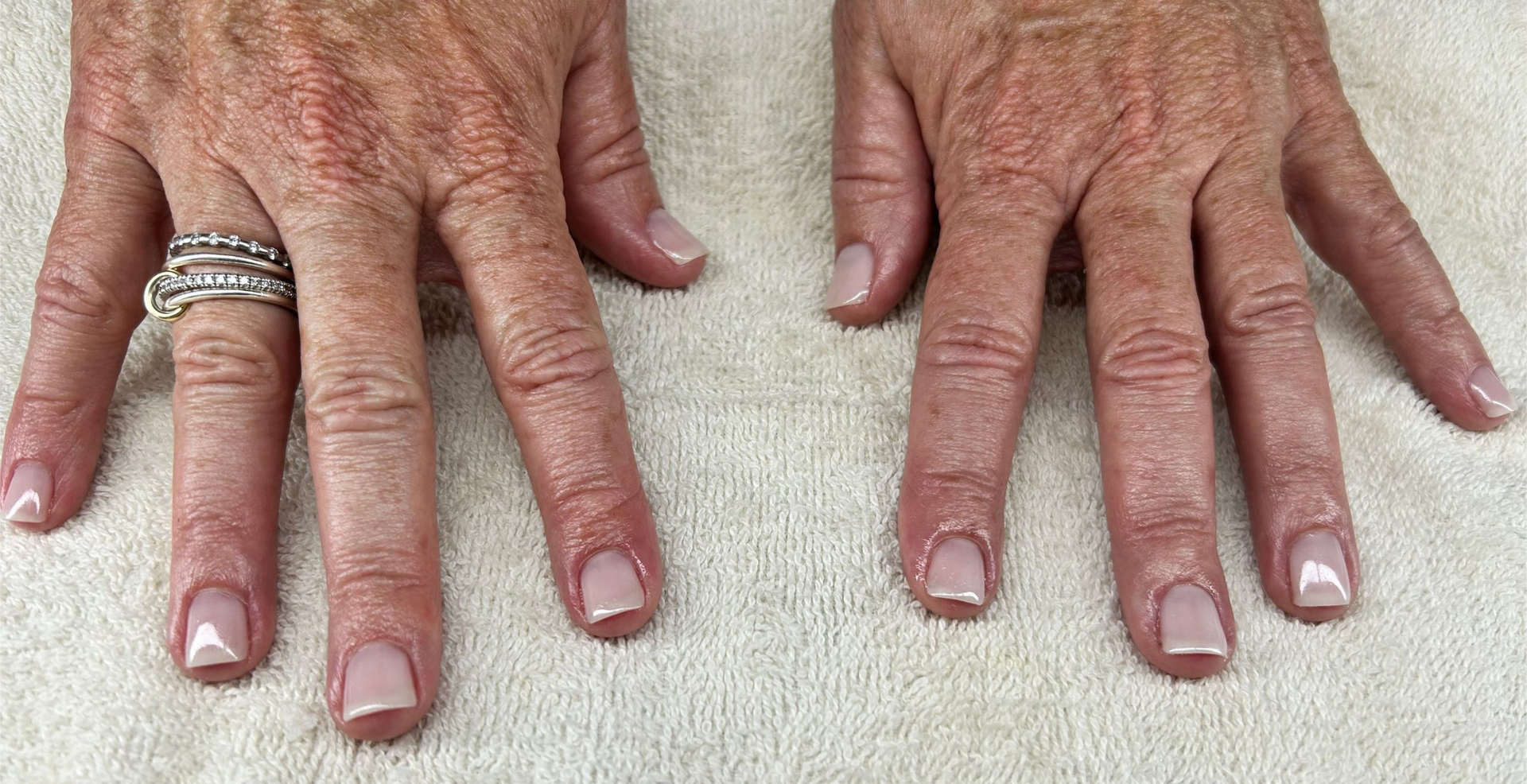 Close up dark painted nails at Spa La La Tampa after a Dazzle Dry manicure.