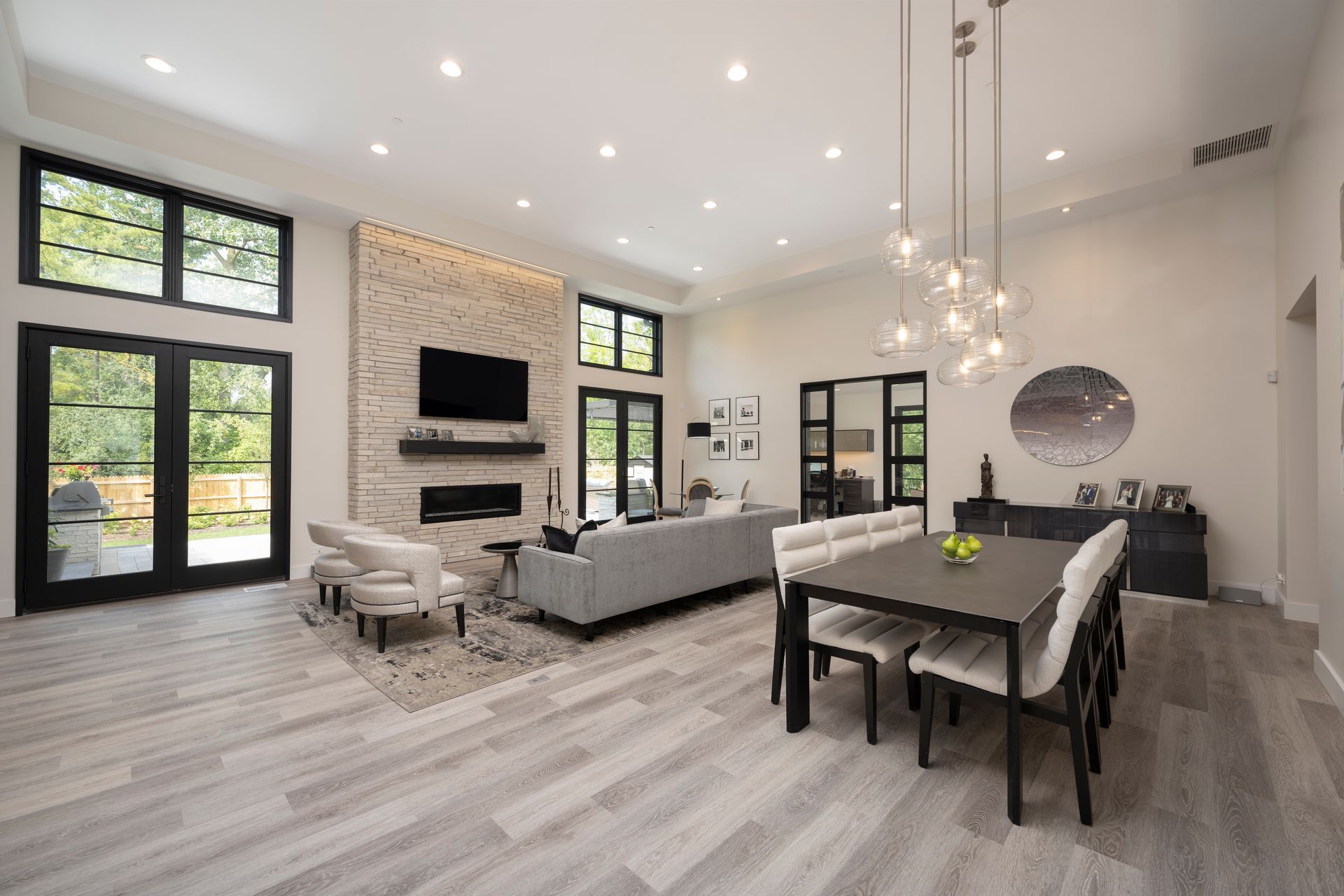 A large living room with a dining table and chairs.