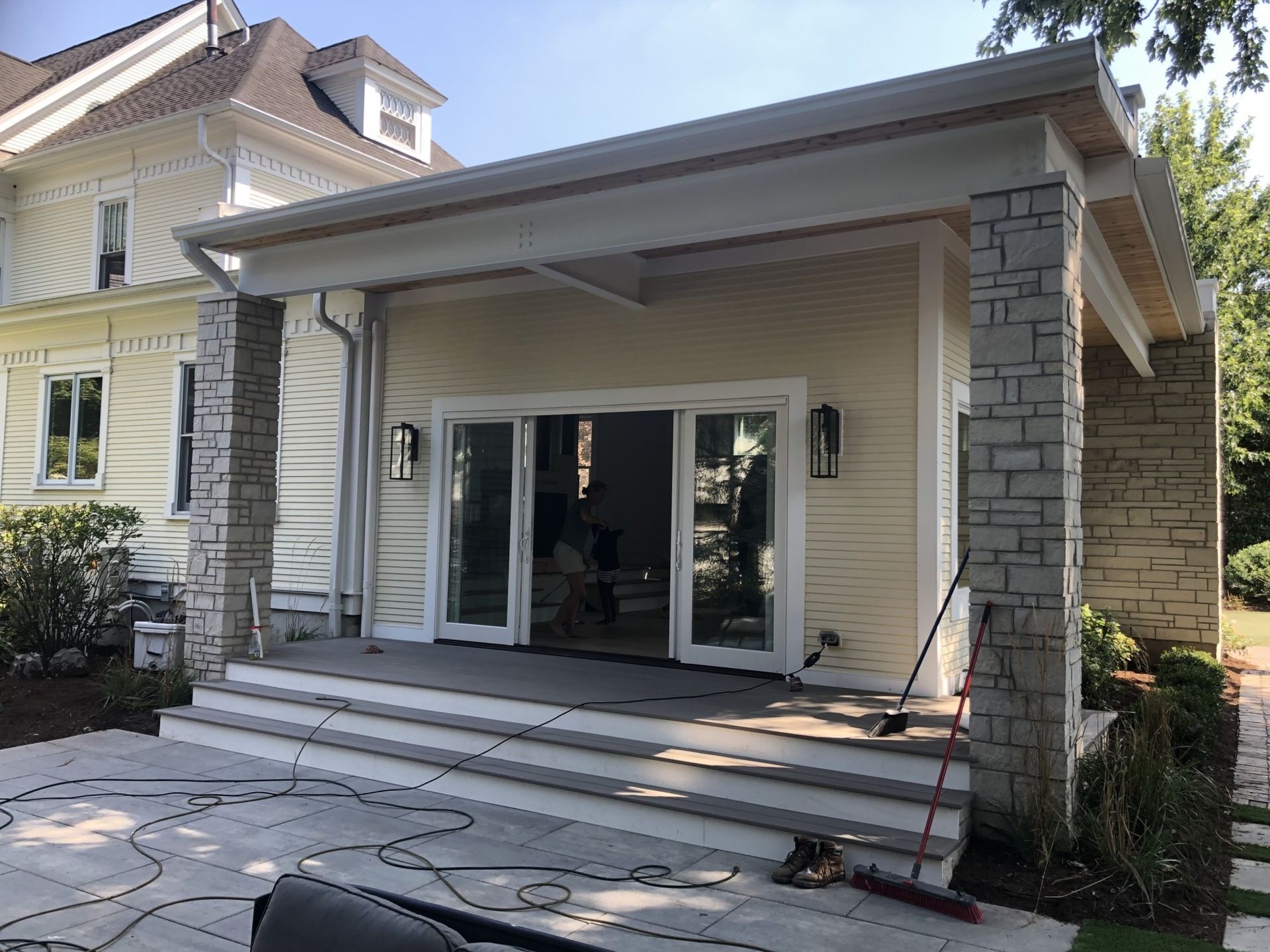 A house with stairs leading up to the front door