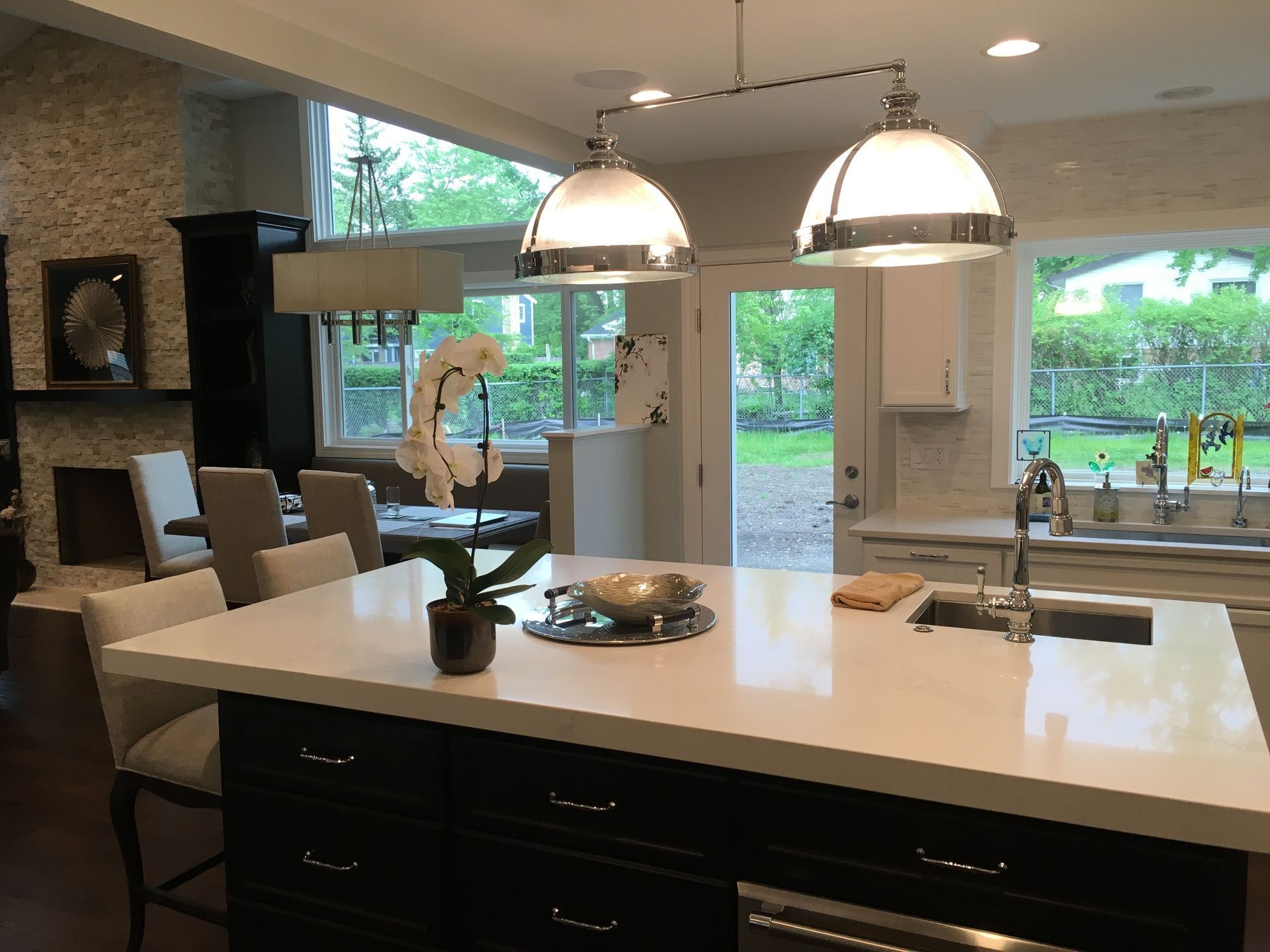 A kitchen with a large island and a sink