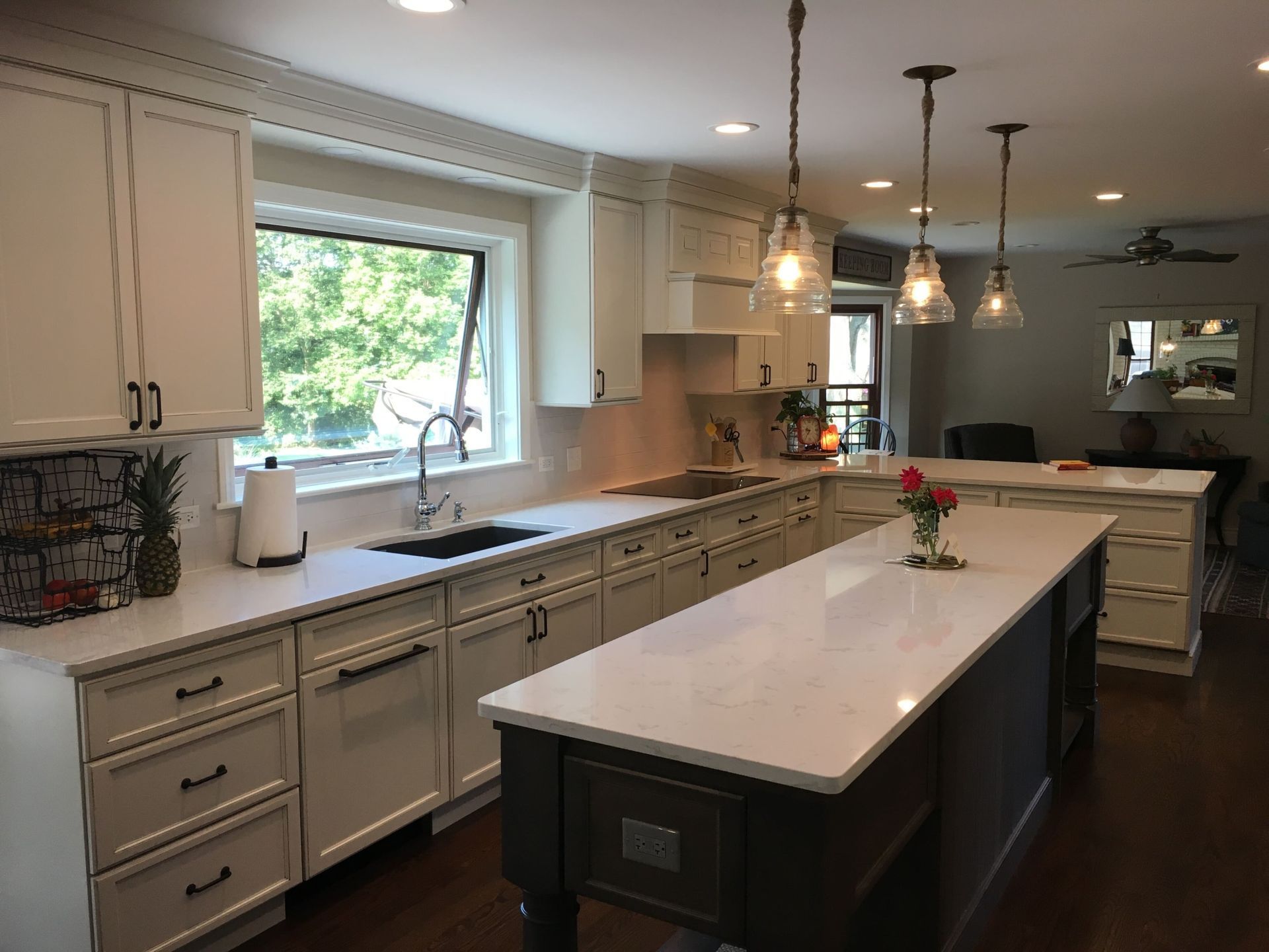 There is a large island in the middle of the kitchen.