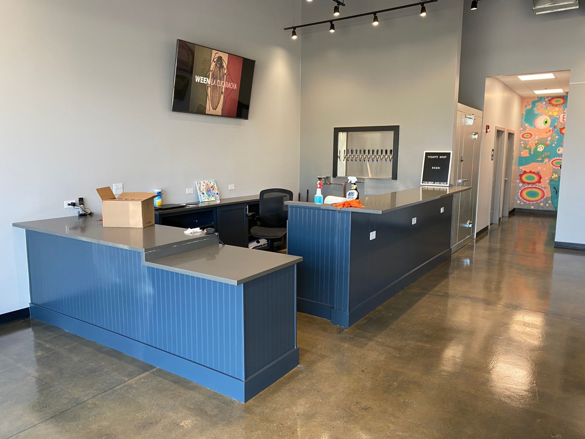 There is a large blue counter in the middle of the room.