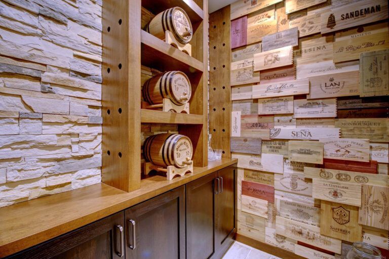 A room with a wooden wall and barrels on shelves.