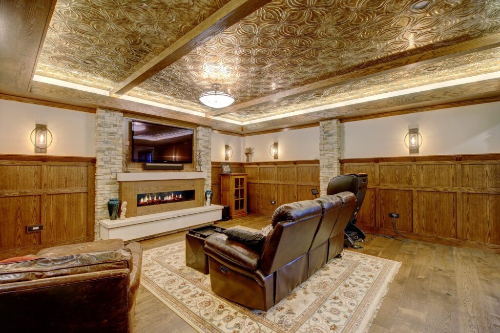 A living room with a fireplace , couch , and television.
