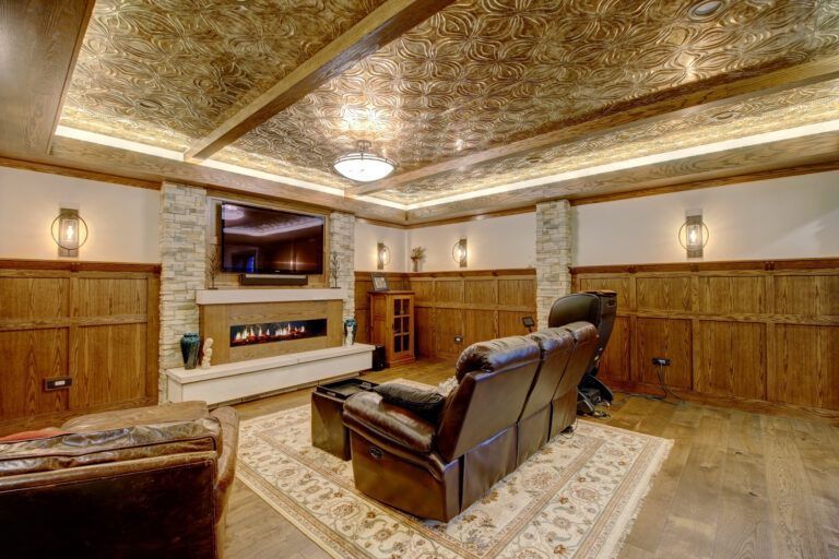 A living room with a fireplace and a flat screen tv.