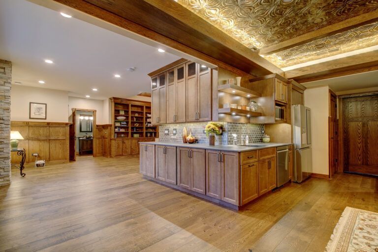 A kitchen with wooden cabinets and stainless steel appliances.