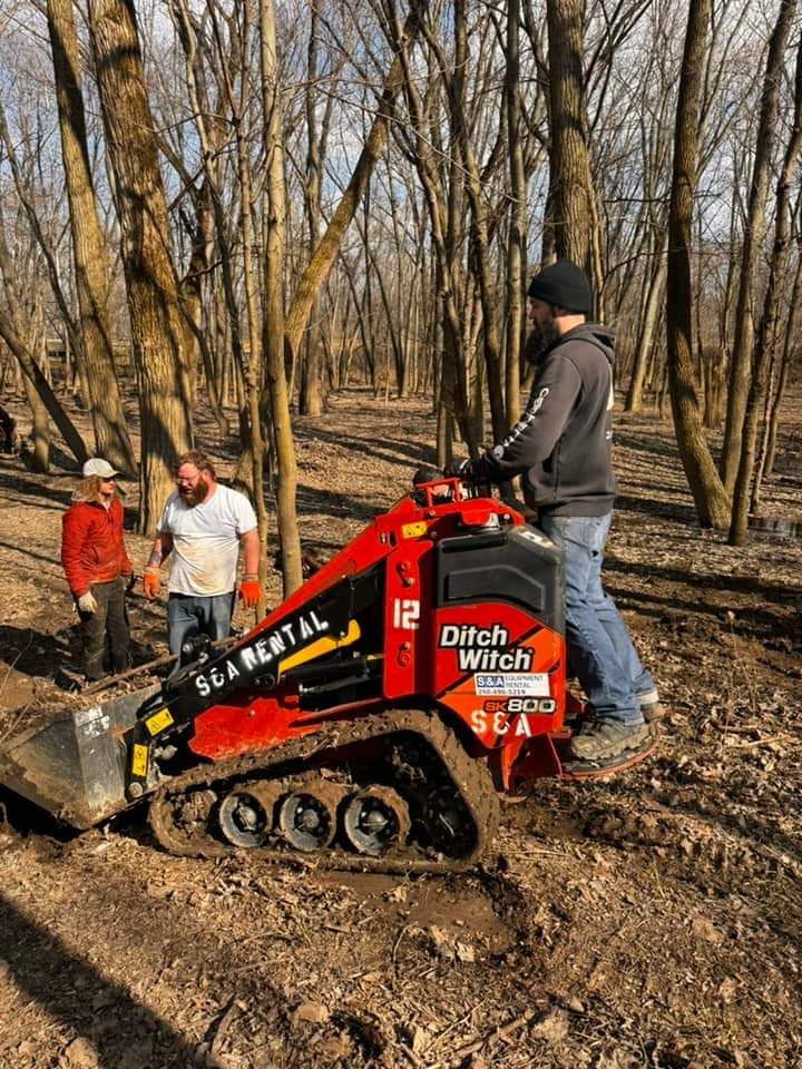 A man is standing next to a tree in the woods — Fort Wayne, IN — Spirit Forest Services