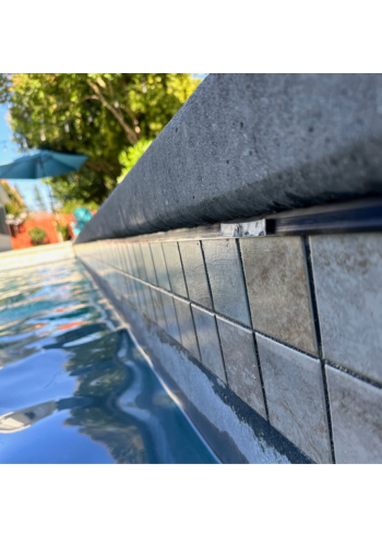 A wall with a lot of blue tiles on it