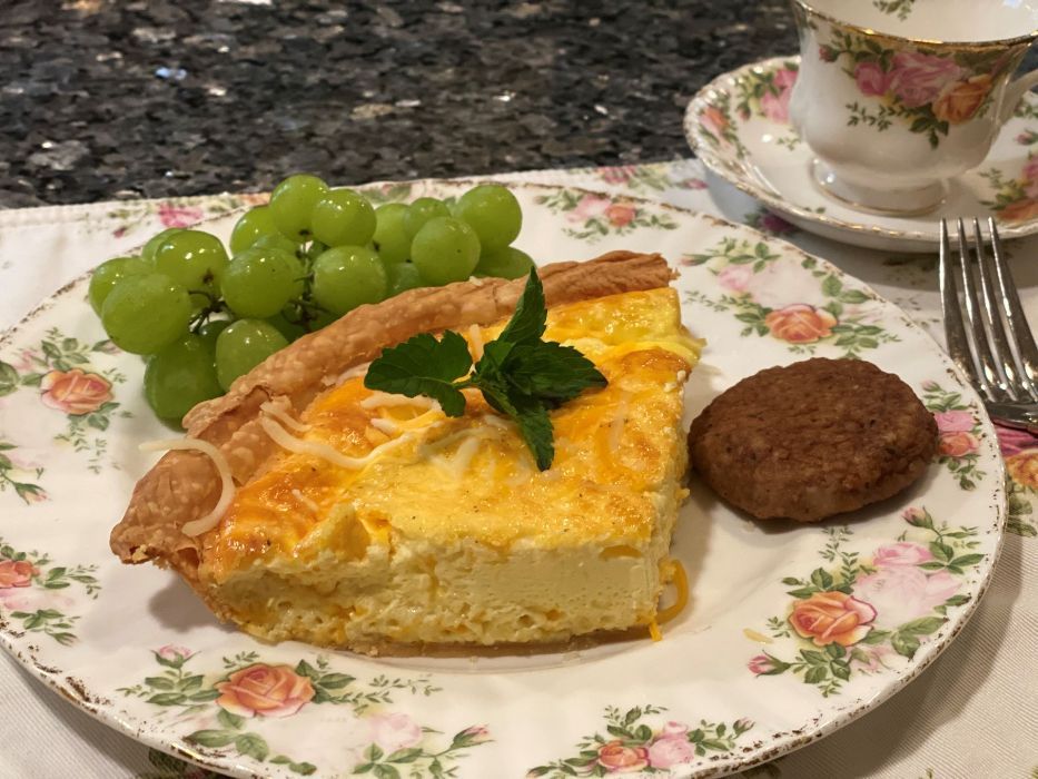 3 cheese quiche served with grapes