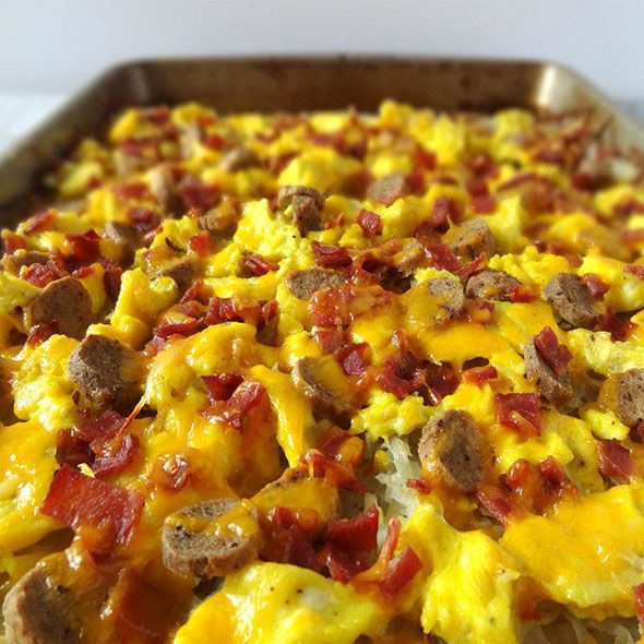 breakfast pizza covered in cheese bacon and sausage