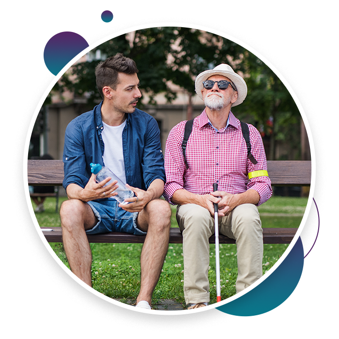 an adult and an elderly sitting on a bench