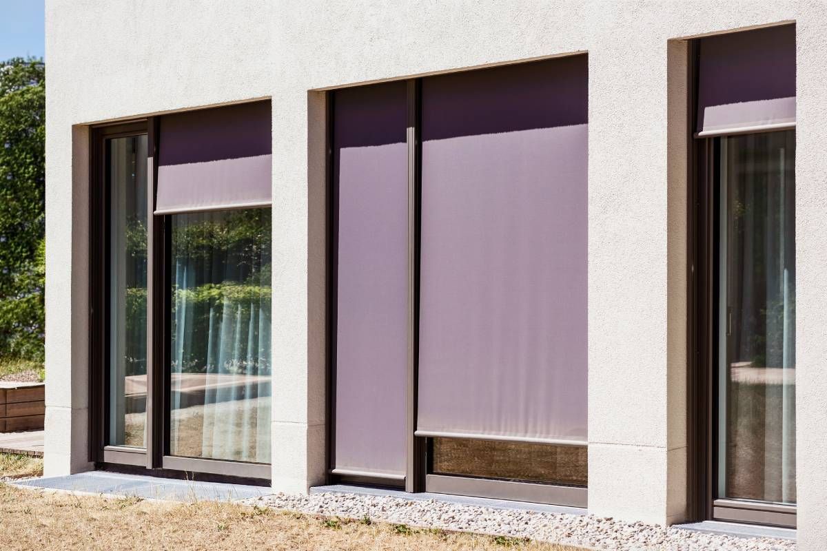 Outdoor shades covering multiple windows on a home near Missoula, Montana