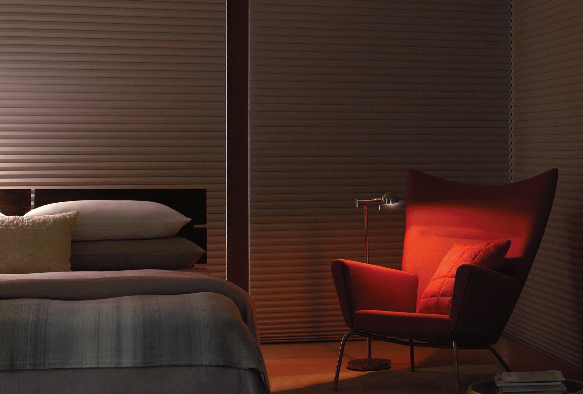 Hunter Douglas blackout shades blocking light in a bedroom. 