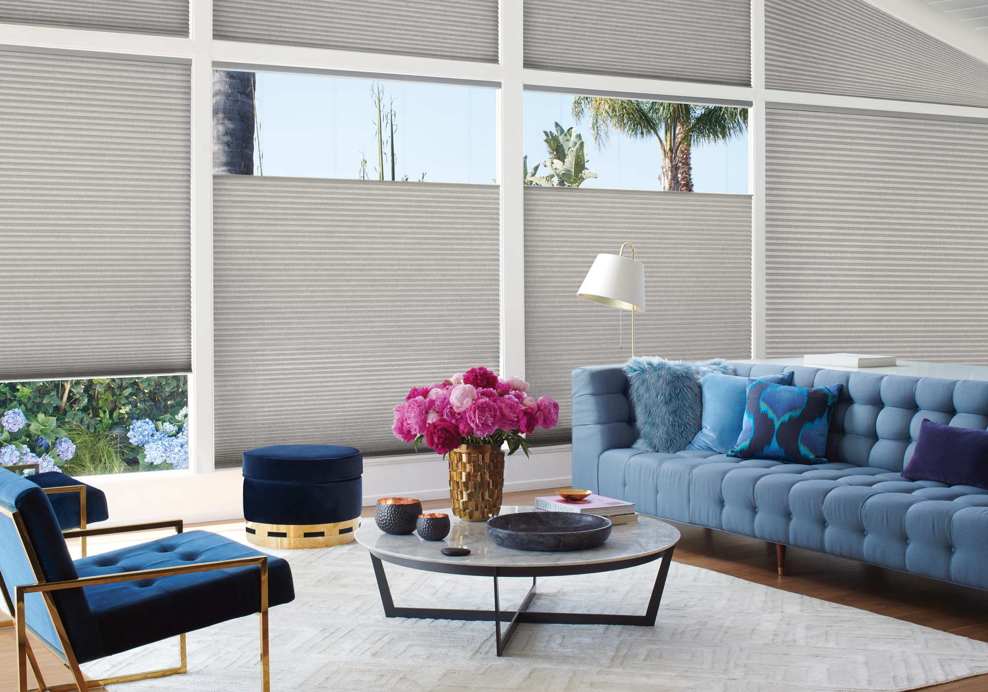 Hunter Douglas Duette® Cellular Shades blocking light in a living room.