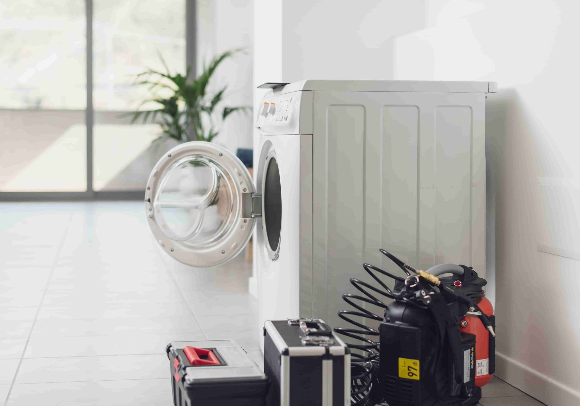 A Washer And Dryer Are Sitting Next To Each Other In A Laundry Room — Tweed Coast Appliance Repairs In Clothiers Creek, NSW