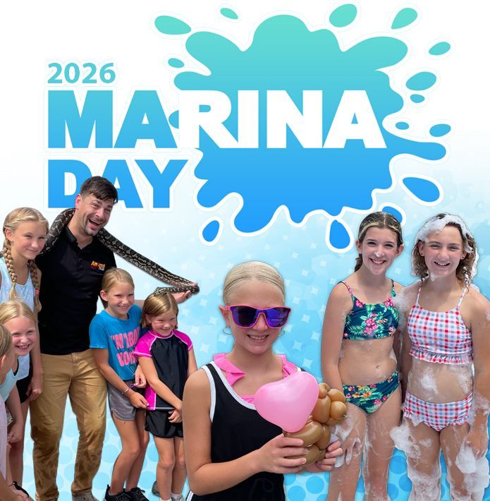 a white yacht is floating on top of a large body of water .