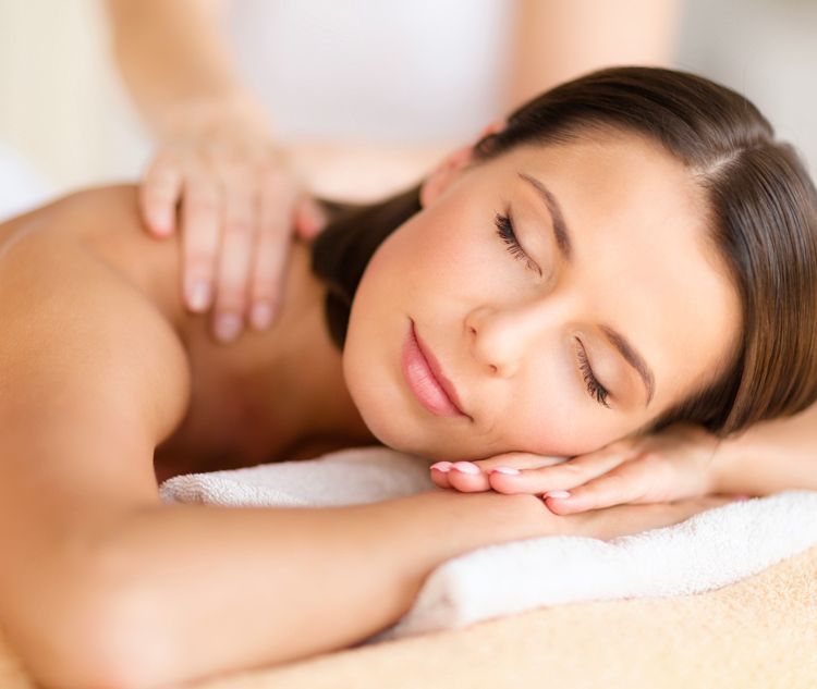 A woman is getting a facial treatment at a spa.