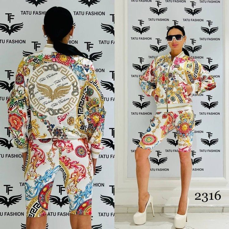 A woman is standing in front of a wall that says tatu fashion