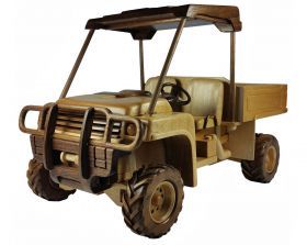 Tan utility terrain vehicle (UTV) with a roll cage, front guard, and open bed.
