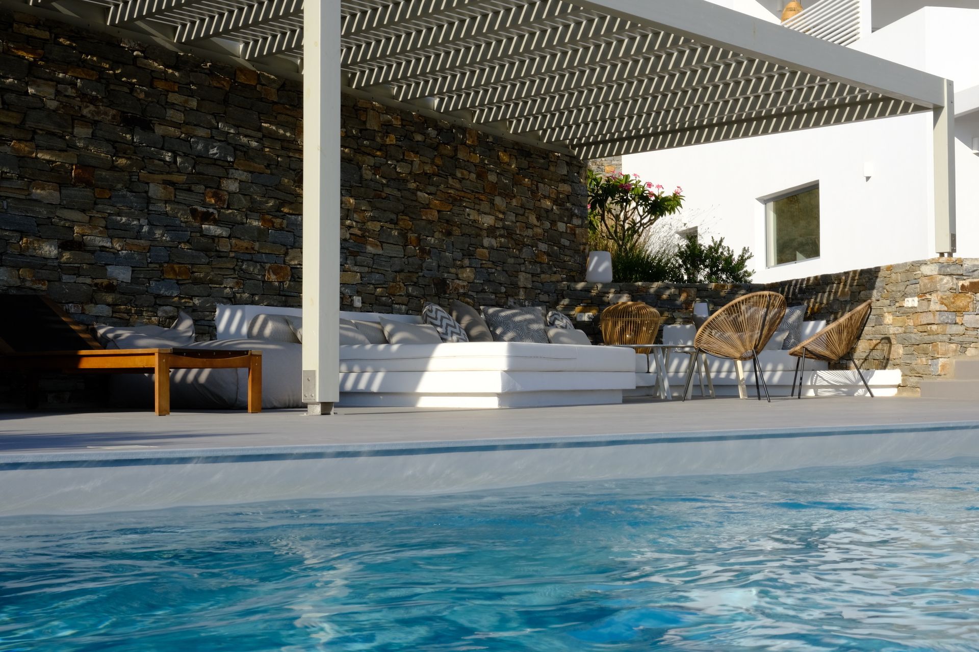 Kyparissi Villa pool area with pergola, sofa, and sea view in Naxos