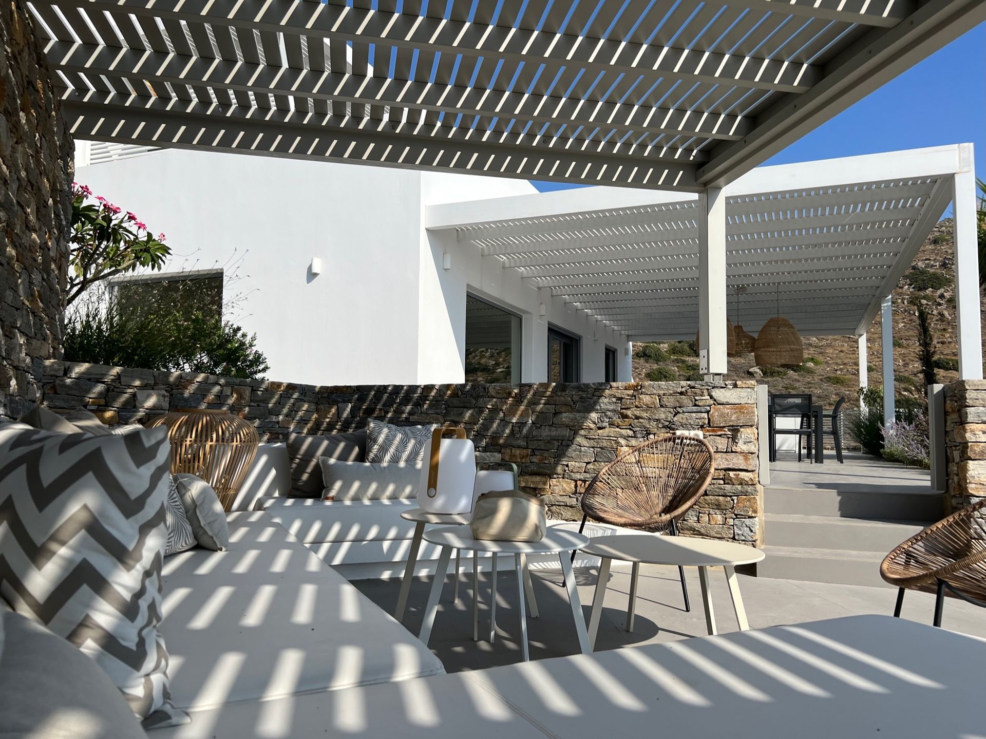 Kyparissi Villa pool area with pergola, sofa, and sea view in Naxos