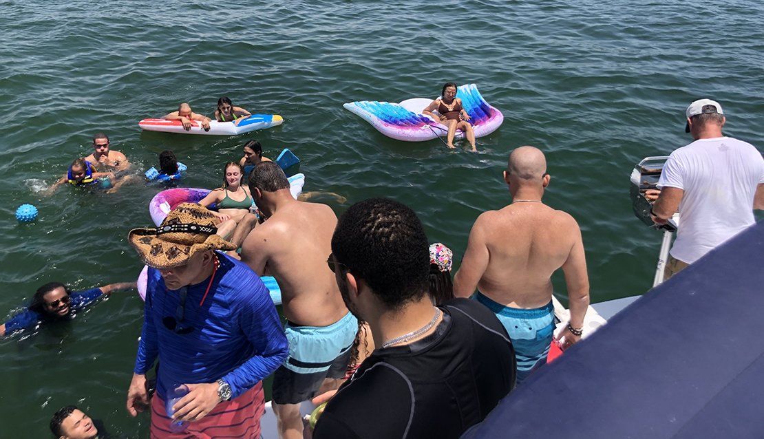 yacht rental party with jet ski on the water