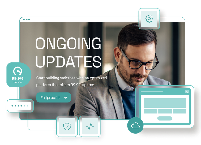 A man wearing glasses is looking at a computer screen.