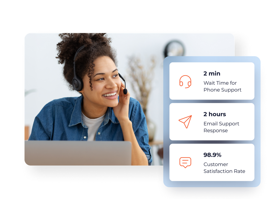 A woman wearing headphones is talking on a cell phone while sitting in front of a laptop computer.