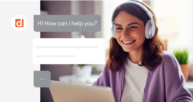 A woman wearing headphones is sitting in front of a laptop computer.