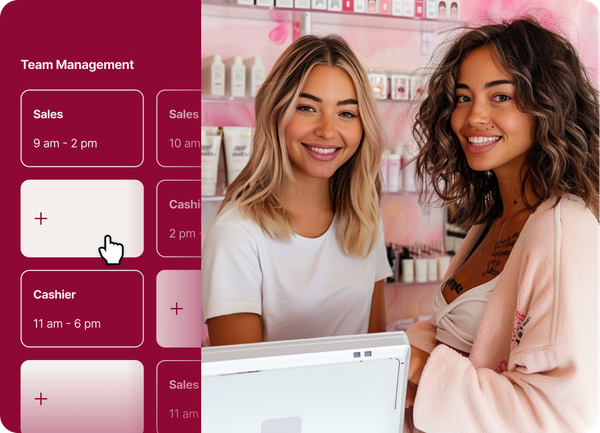 Two women are sitting at a counter in a store and smiling.