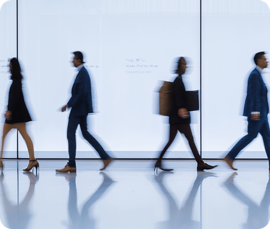 A blurry picture of people walking in a line