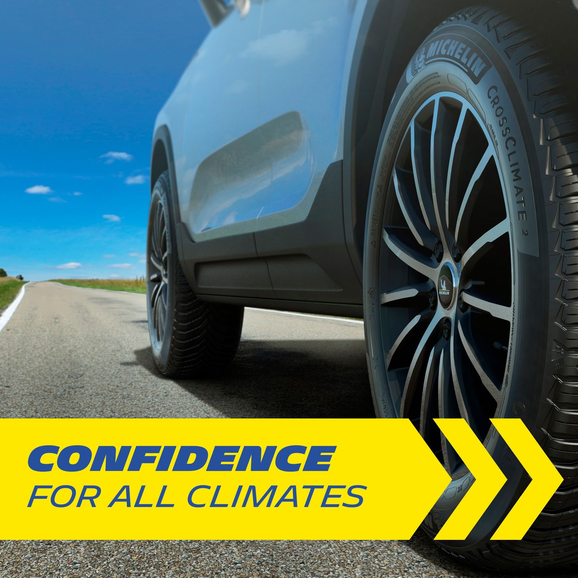 a white car is parked on the side of a road with a yellow sign that says confidence for all climates
