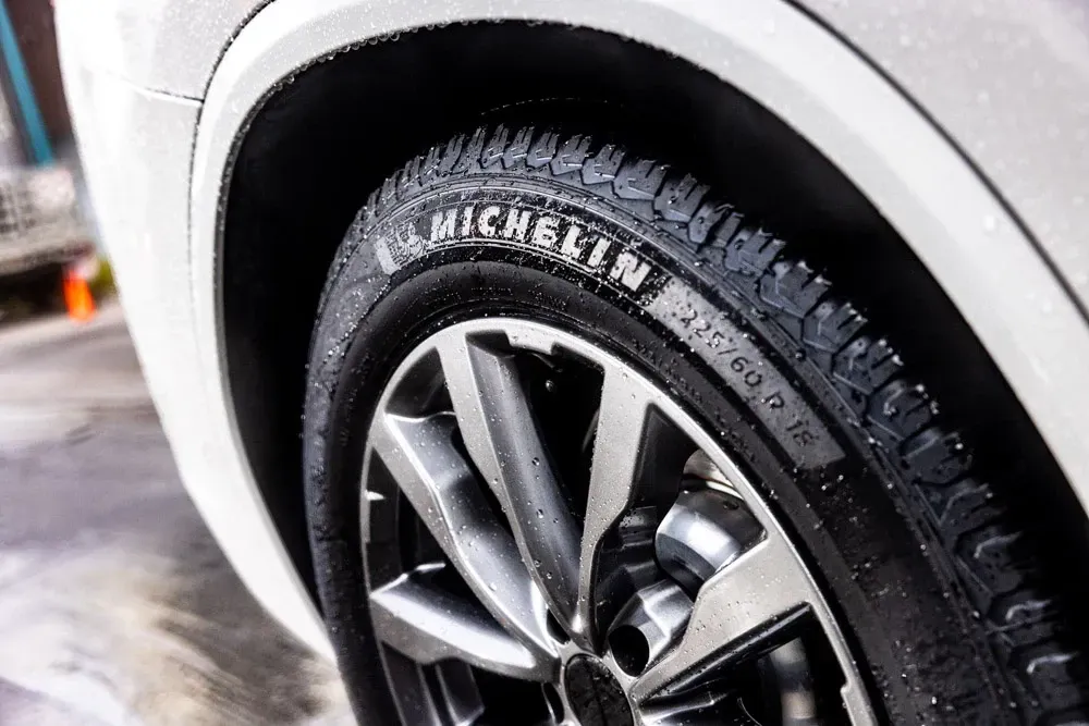 a close up of a tire on the side of a car .