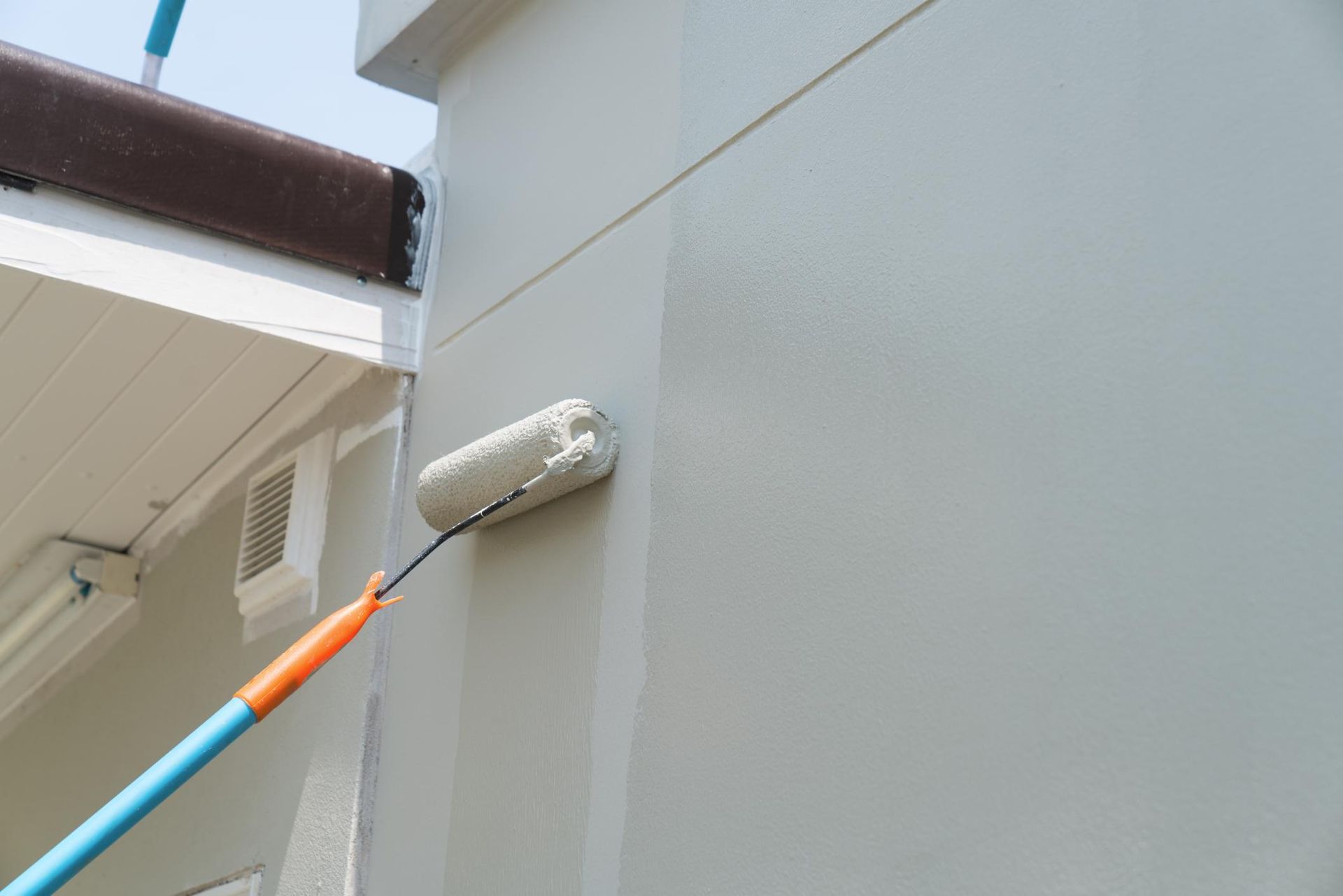 a paint roller is being used to paint a wall