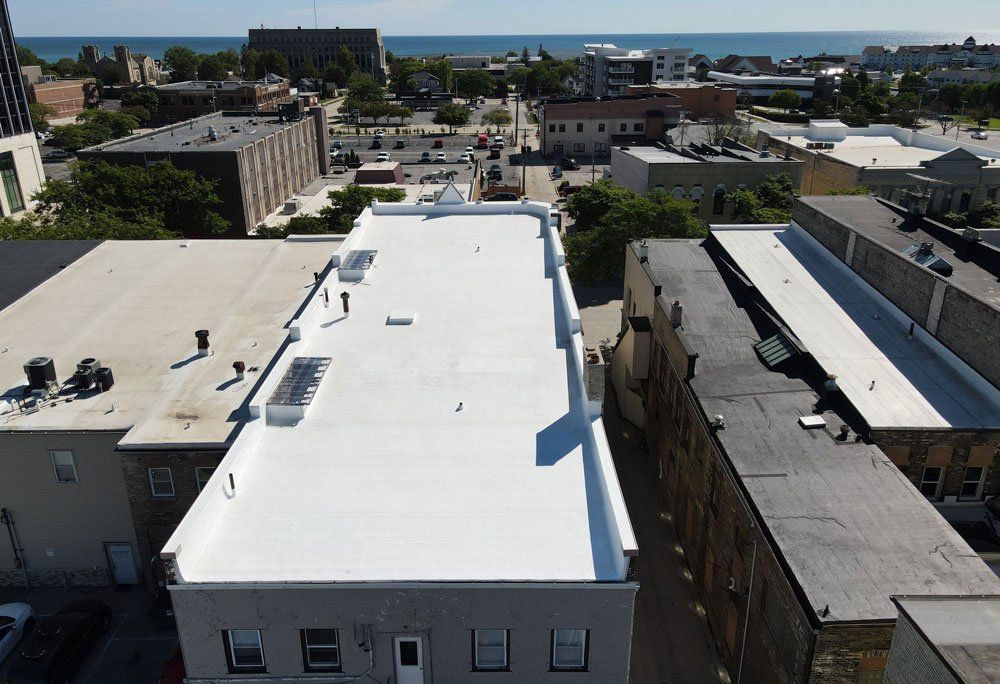 Flat Roof Of A Commercial Building — Oostburg, WI — Custom Craft Roofing & Construction LLC